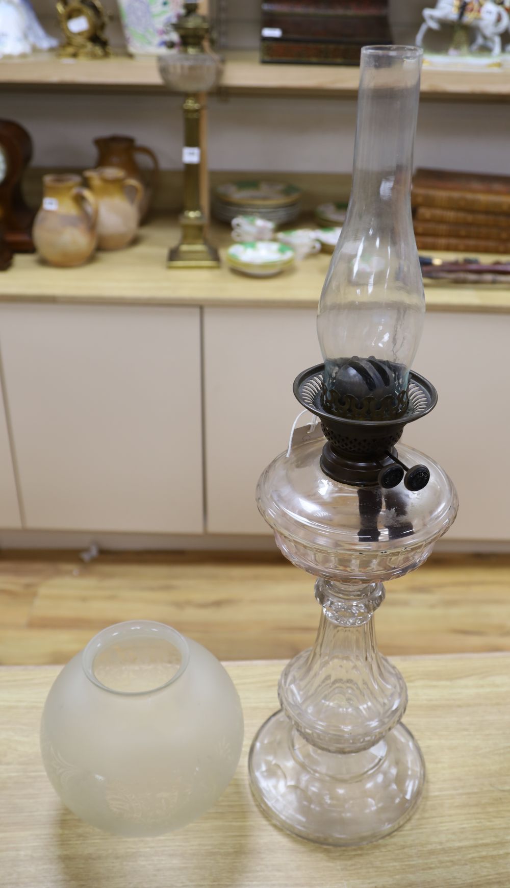 An Edwardian cut glass oil lamp